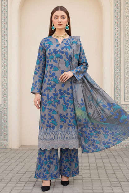 Model wearing blue and teal Danak printed 3-piece unstitched suit with embroidered daman