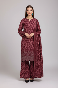 Model wearing maroon Danak printed 3-piece unstitched suit with embroidered daman